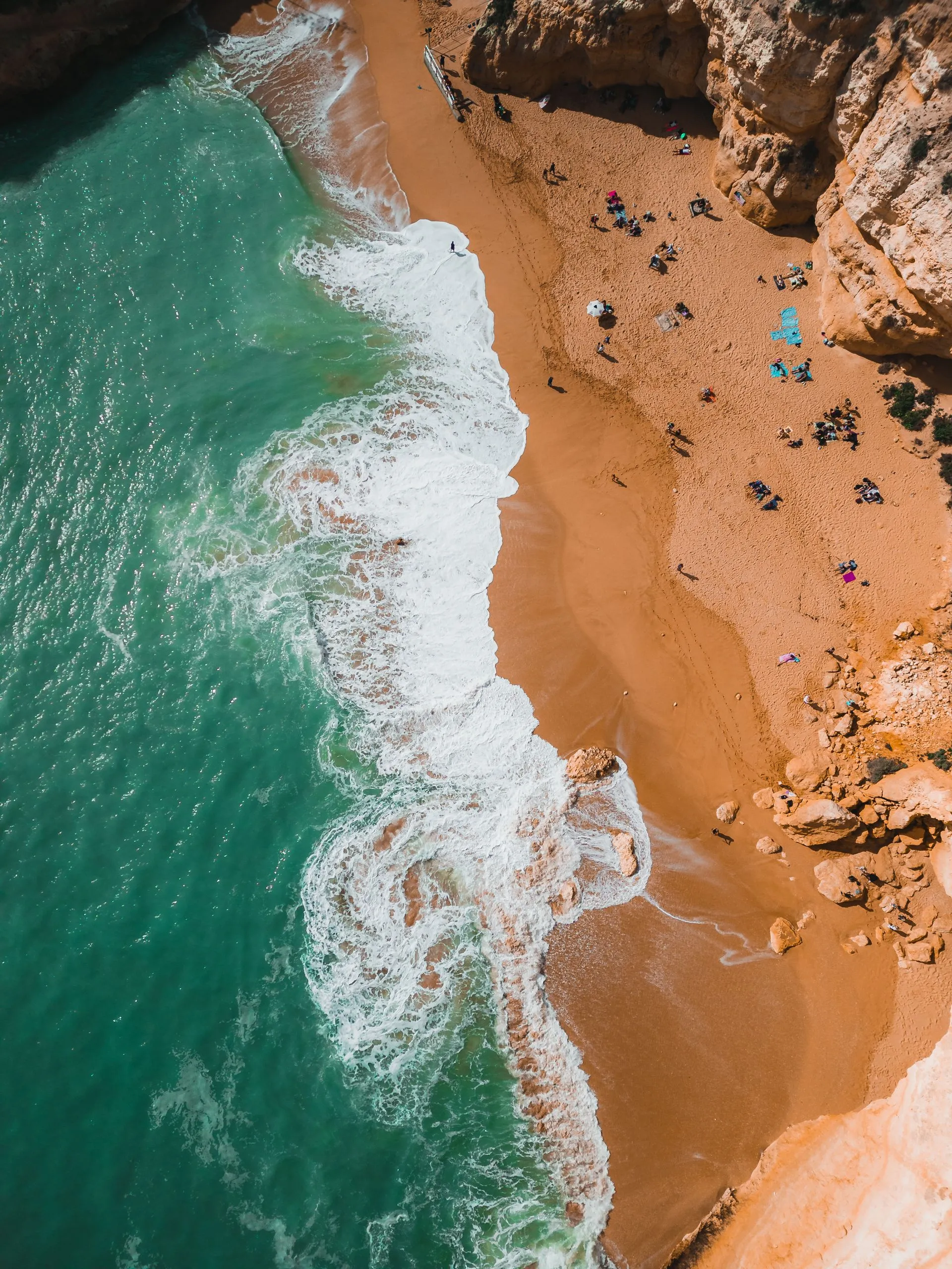 Aerial view of the Algarve coastline with sandy beaches and blue Atlantic water